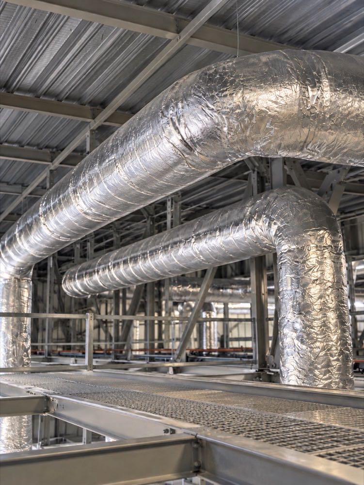 Gaines de ventilation circulaires calorifugées sous toiture métallique